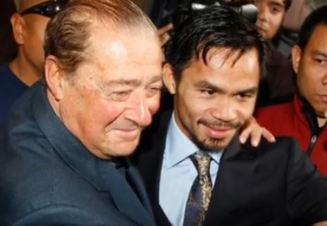 Pacquiao and Arum hugging