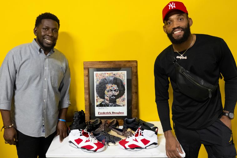 Dr. Willie J. Montague with UFC welterweight Phil Rowe sneaker drive