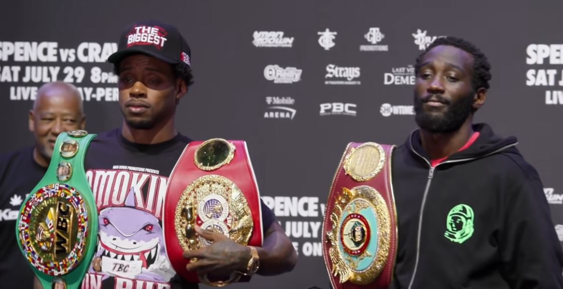 Errol Spence Jr and Terence Crawford side by side with belts