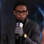 Keyshawn Davis speaks on mic at Denis Berinchyk press conference