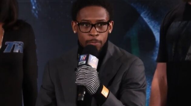 Keyshawn Davis speaks on mic at Denis Berinchyk press conference