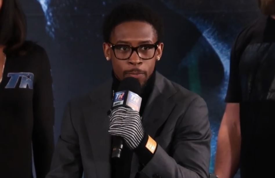 Keyshawn Davis speaks on mic at Denis Berinchyk press conference