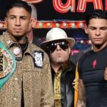 Mario Barrios holding WBC belt with Ryan Garcia