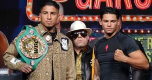 Mario Barrios holding WBC belt with Ryan Garcia