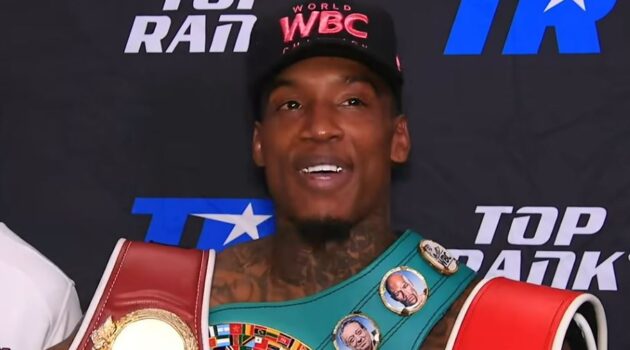O'Shaquie Foster with WBC hat and boxing world title belts