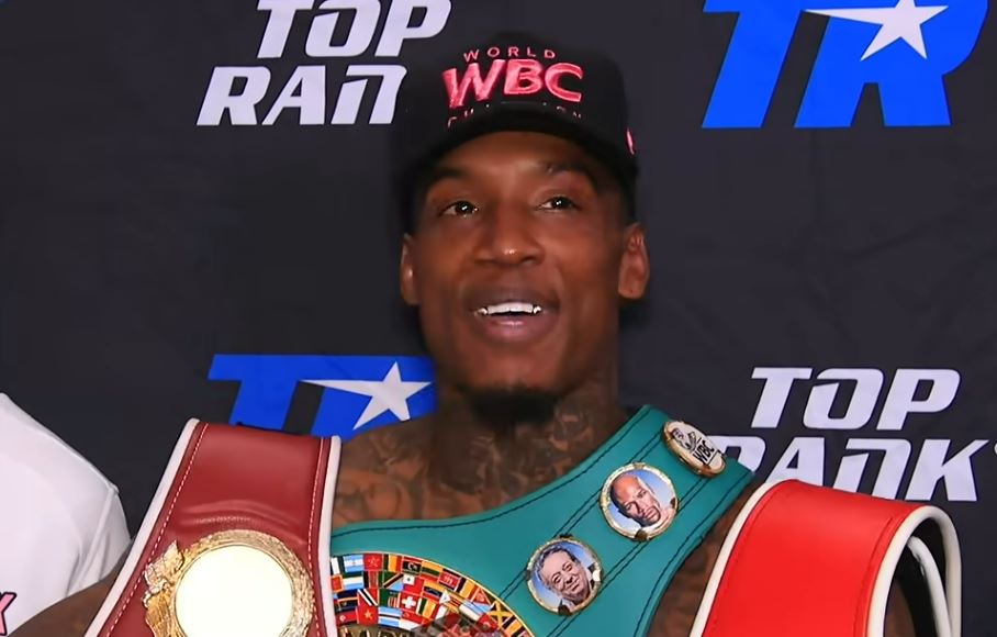 O'Shaquie Foster with WBC hat and boxing world title belts