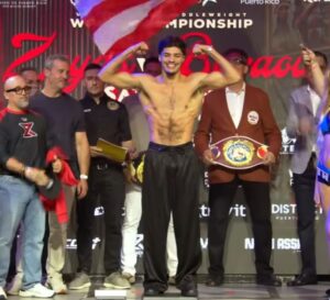 Xander Zayas flexes muscles at weigh in