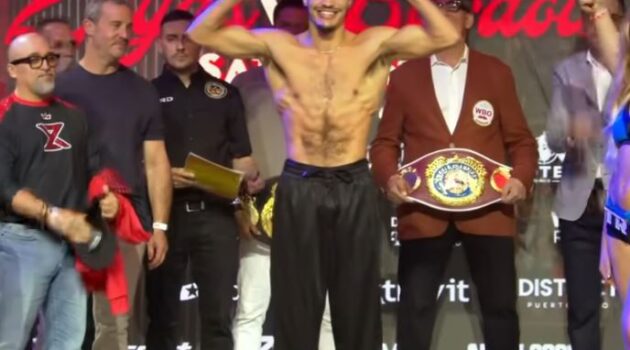 Xander Zayas flexes muscles at weigh in