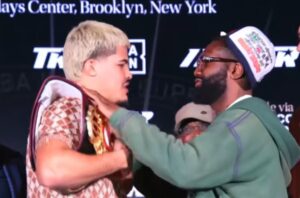 Boots Ennis rubs Xander Zayas belt